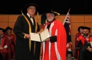 Vice-Chancellor, Professor S. Bruce Dowton presents Phillip Adams AO with the honorary doctorate. Credit: Dermot Walsh