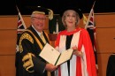 Chancellor The Hon Michael Egan AO presents Ita Buttrose AO OBE with the honorary doctorate. Credit: Dermot Walsh