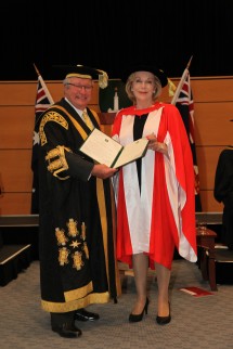 Chancellor The Hon Michael Egan AO presents Ita Buttrose AO OBE with the honorary doctorate. Credit: Dermot Walsh
