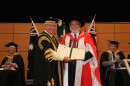 Chancellor The Hon Michael Egan AO presents Professor Sir Peter Knight FRS with the honorary doctorate. Credit: Dermot Walsh