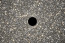 A new study has discovered the smallest galaxy yet known to harbor a supermassive black hole.