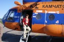 Dr Elena Belousova boarding a helicopter. Photo credit: Professor Yuri Kostitsyn