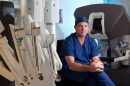 Professor Michael Wilson with the XI da Vinci Surgery System.