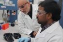Researchers Anwar Sunna (right) and Vinoth Kumar Rajendran with their smartphone-enabled MRSA detector.
Credit: Sunna Lab