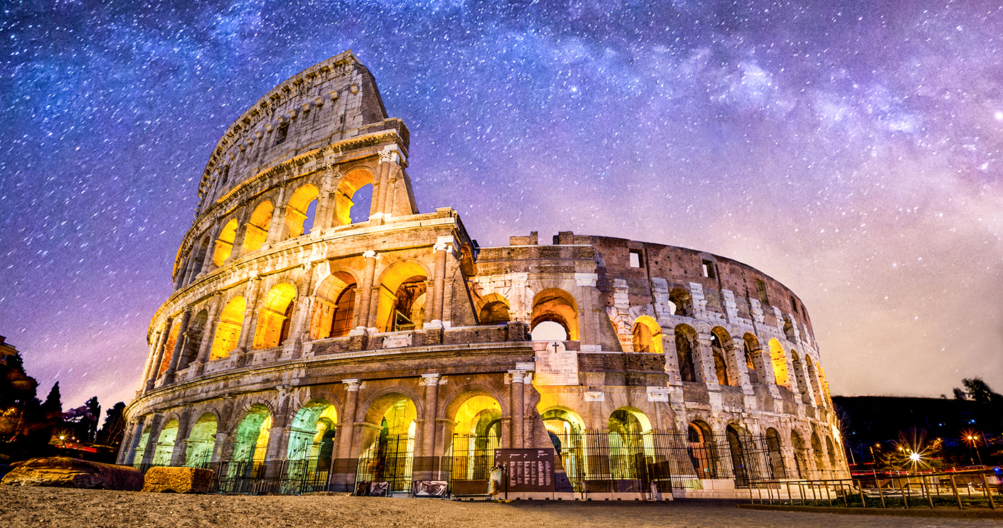 front view of Coliseum of Rome at night with the milky way. Italy